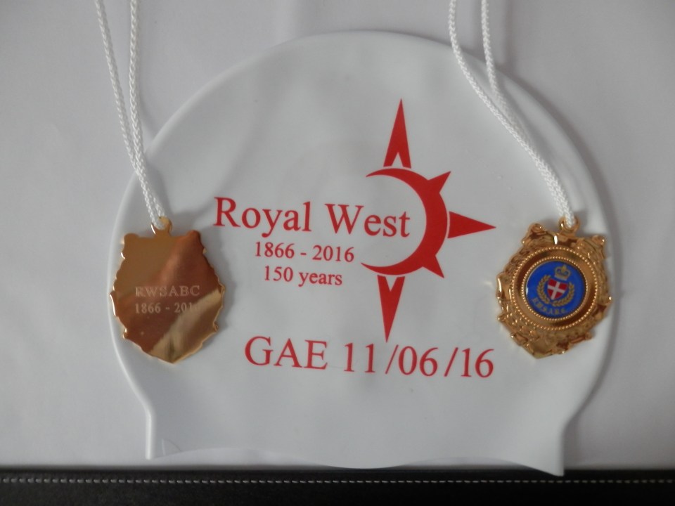The cap and the medal from the swim