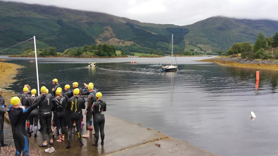 Swimmers gather for the briefing before their race